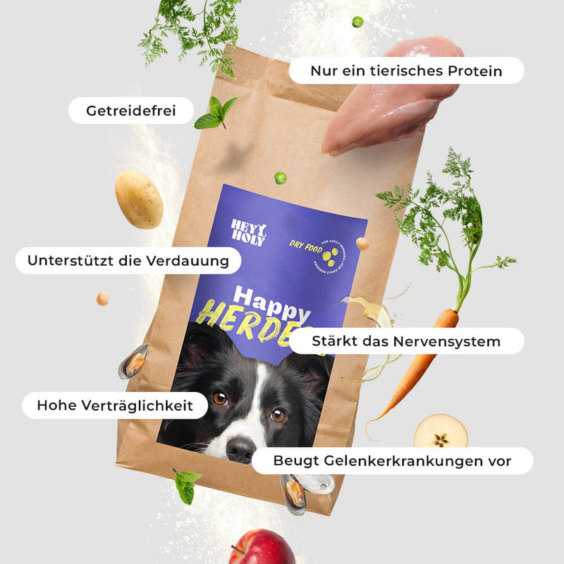 HEY HOLY Happy Herders Trockenfutter mit Border Collie und schwebenden Zutaten wie Karotten und Kartoffeln